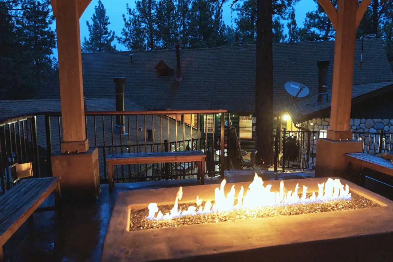 Outdoor fire pit lit at dusk