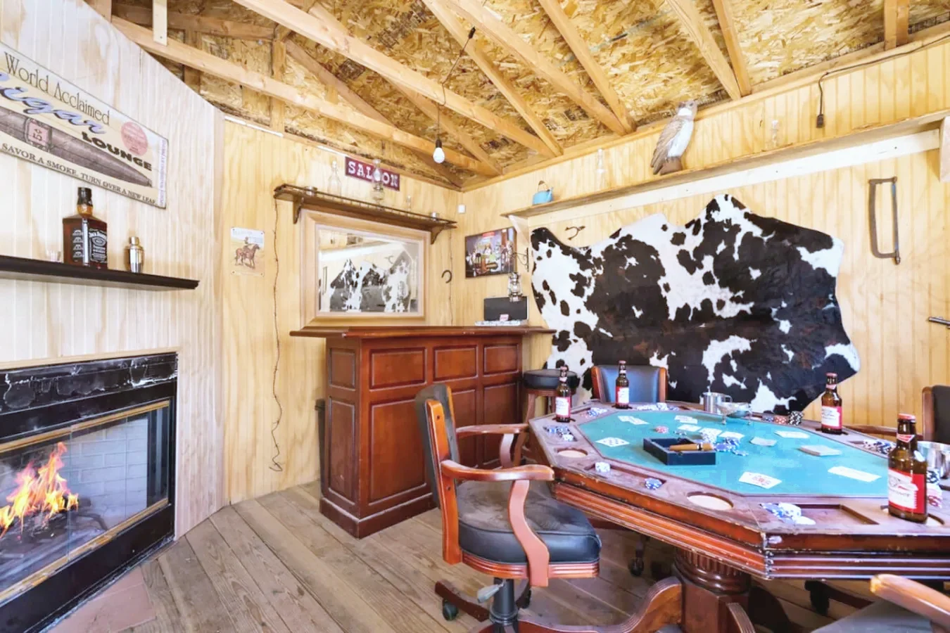 Poker room with a fireplace and bar